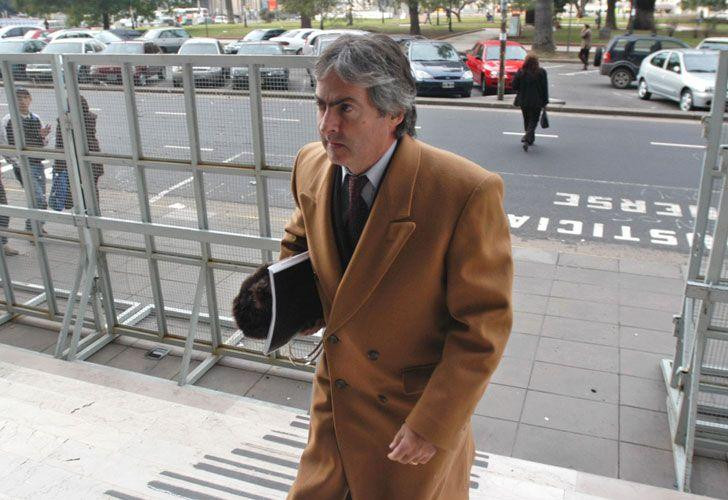 Juan José Ribelli, AMIA, ex policía